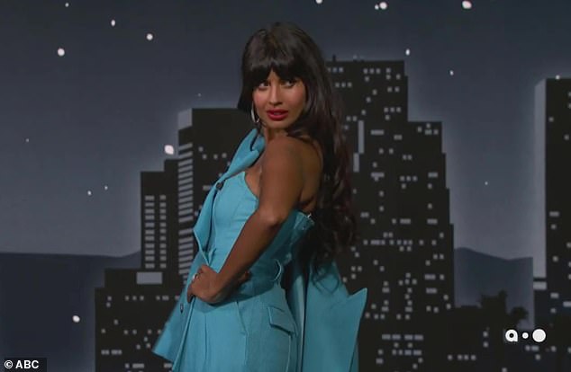 Striking poses: Jameela looked stunning in a sleeveless light blue jumpsuit paired with a matching coat that she draped over one shoulder as she was greeted by guest host Nikki Glaser