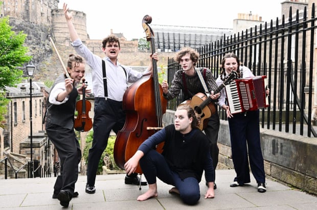 Actor-musicians perform on the streets of Edinburgh.