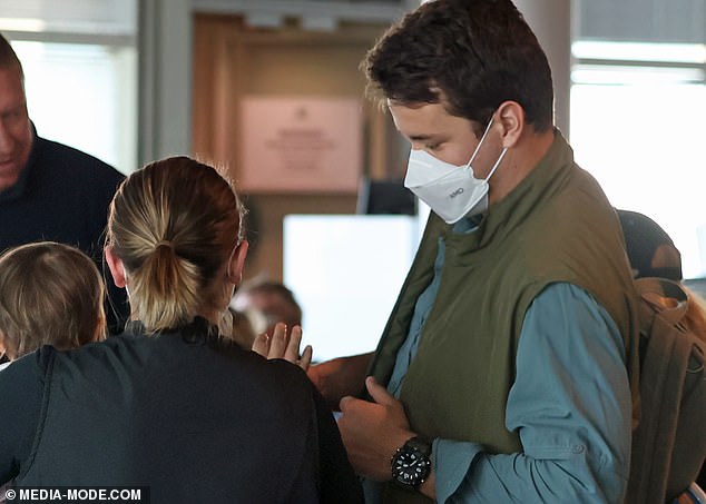 Chandler was seen doting over her baby girl as they waited for their flight to leave