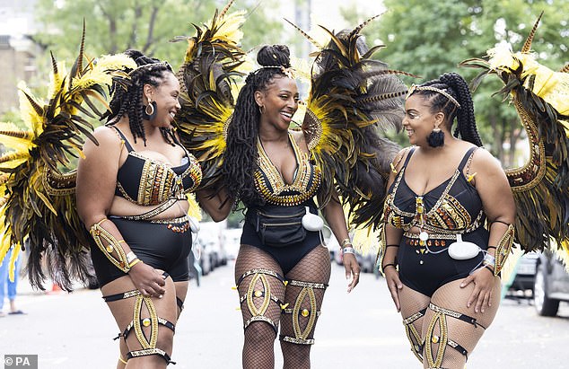 In good company: She attended the Notting Hill Carnival alongside family-run band Utopia Mas UK