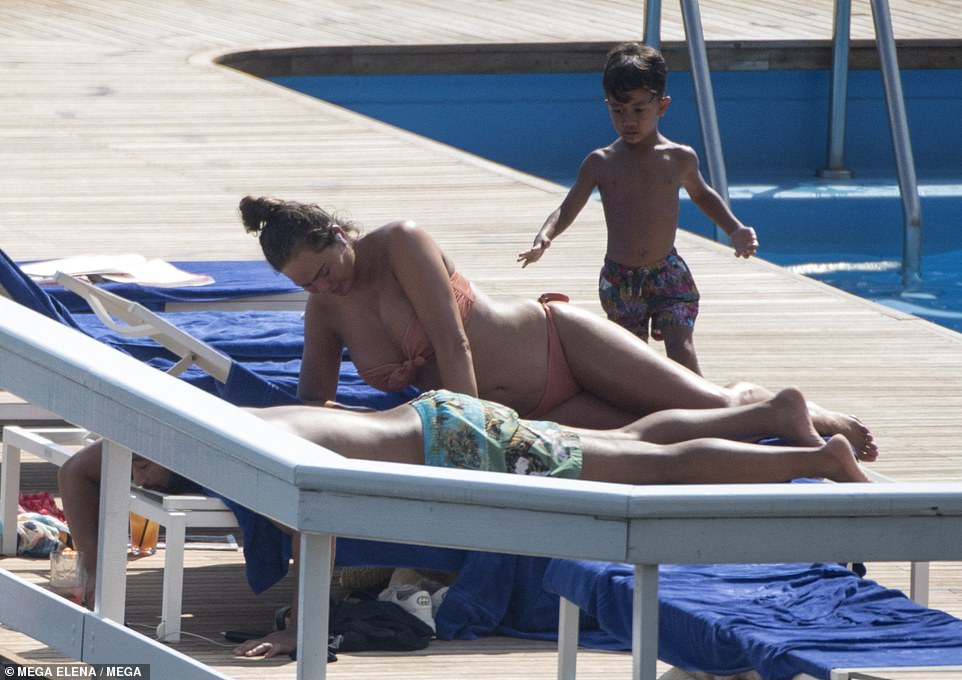 Energetic: Miles donned a pair of colourful swimming trunks as he ran up behind his mum