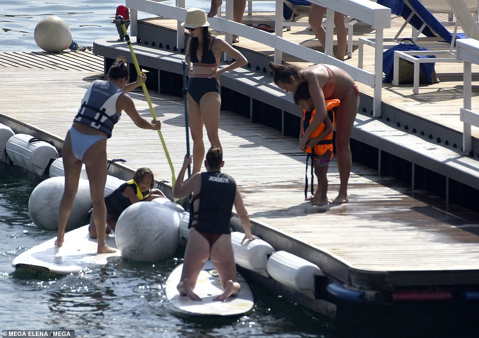 Safety first: While Chrissy ensured Miles was safe in a bright orange life jacket