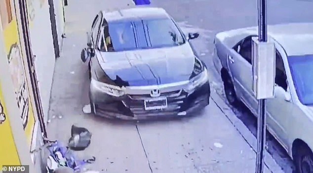 After fatally striking Storch, the driver backs away slowly, pauses at a stop sign and drives off