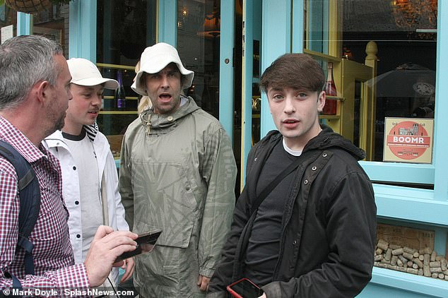 Autograph? The Oasis singer also signed autographs as dozens queued for the chance of a selife