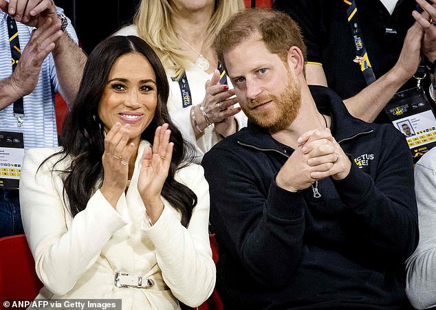 'She's just - I love her!' radio star Kate, 47, told her co-stars. Meghan is pictured withher husband Prince Harry