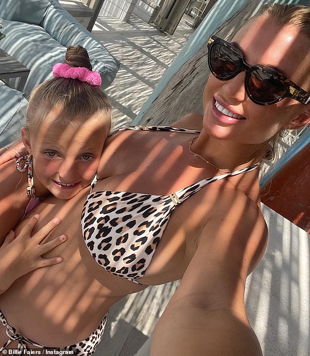 Growing bump: The Mummy Diaries star also added that she been seriously craving tea and biscuit recently but has 'gone off meat completely' (pictured with daughter Nelly, eight)