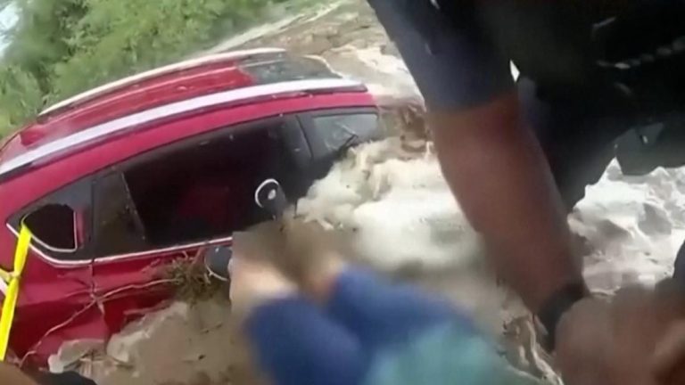 'The water is coming!': First responders scramble to pull woman from flooding car