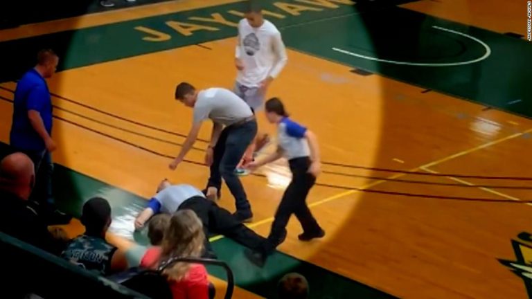 A referee collapsed during a basketball game. See what happened next