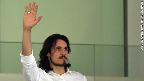 Cavani waves to fans at the Mestalla. 