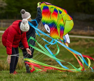 Two people with a kite