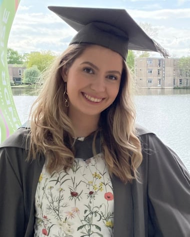 Beth at her graduation, wearing gown and mortarboard