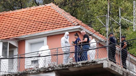 State prosecutor Andrijana Nastic talks to the forensic team at the house where a gunman started a mass shooting in Cetinje, Montenegro August 12, 2022.