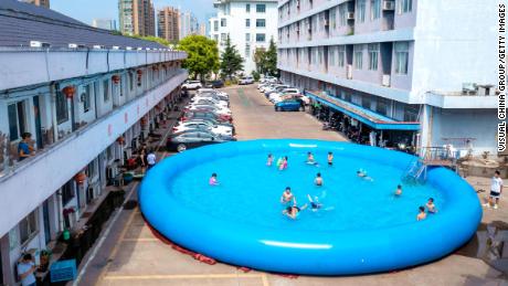 Children beat the heat at a gated community in Huzhou City in China&#39;s Zhejiang Province on August 12, 2022.