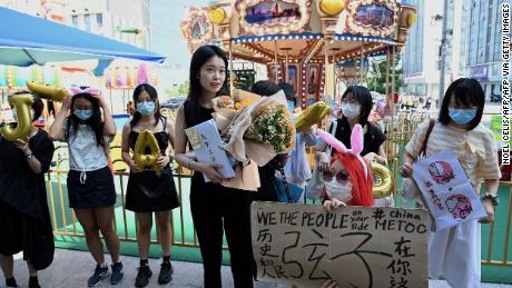 Zhou Xiaoxuan is greeted by a small group of supporters on Wednesday before returning to court for a hearing on her sexual harassment case against television host Zhu Jun.