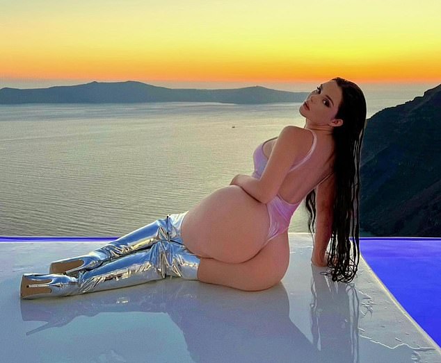 Demi Rose puts on a VERY racy display in a thong swimsuit during Santorini getaway