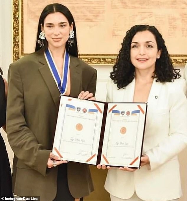 Dua Lipa poses with the President of Kosovo’s delighted twins as she is made an Honorary Ambassador