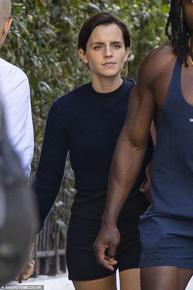 Emma Watson is dwarfed by her statuesque personal trainer