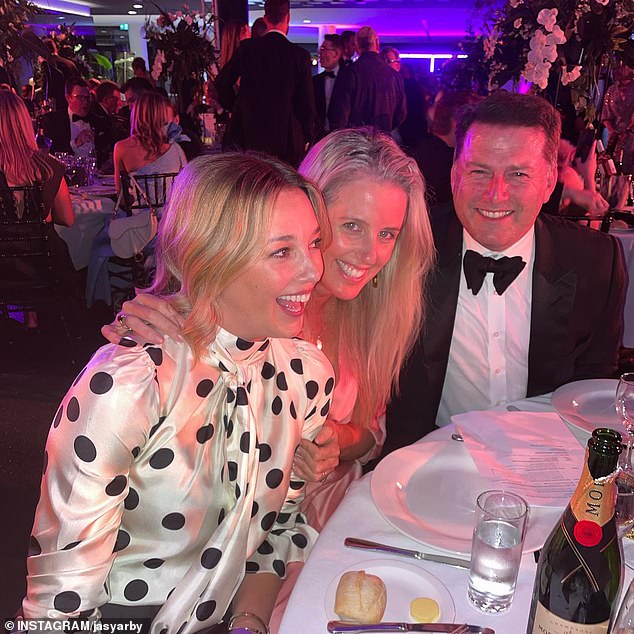 Jasmine Yarbrough stuns in a polka dot dress as she cuddles up to Karl Stefanovic at charity ball