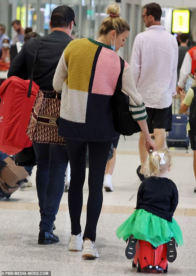 Karl Stefanovic’s daughter Harper accidentally takes a tumble on her suitcase at Brisbane airport