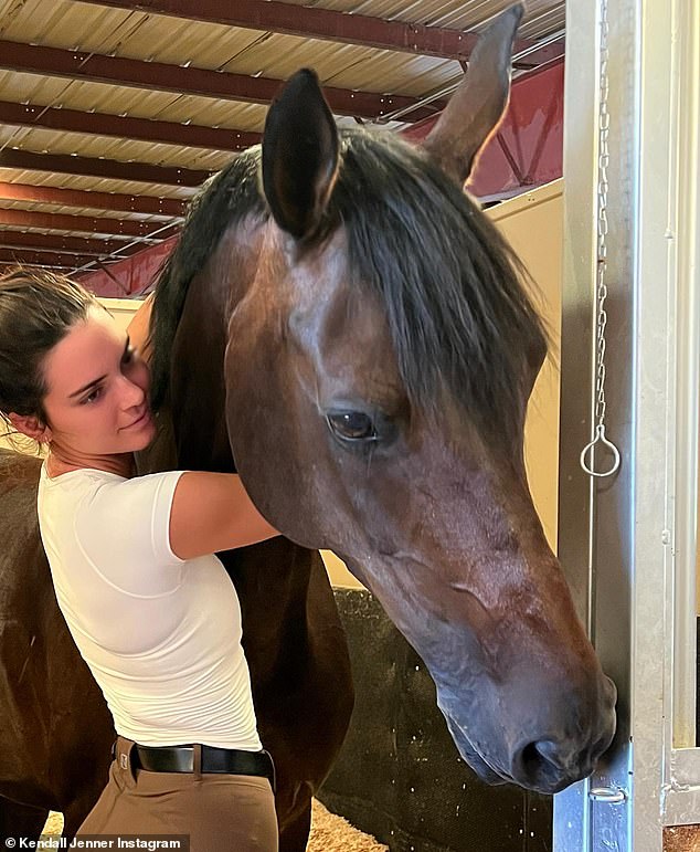 Kendall Jenner flaunts slim physique in riding pants while giving loving hug to her horse in post