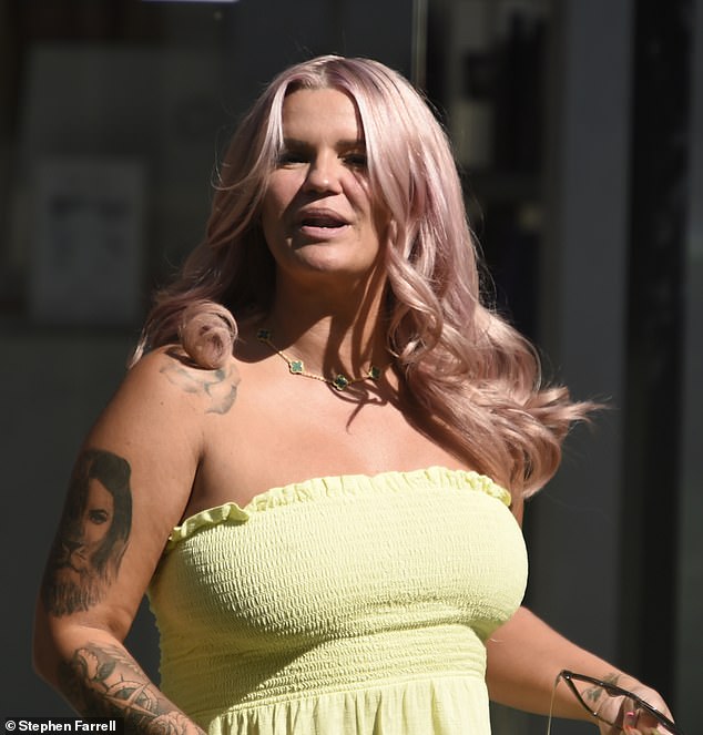 Kerry Katona ditches her trademark blonde locks and debuts her new pink hairdo in Cheshire