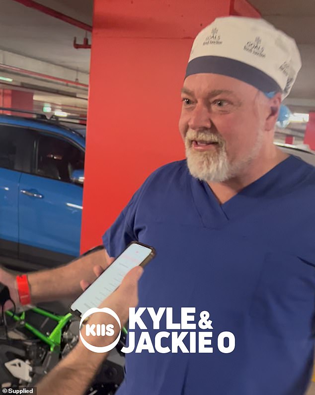 Kyle Sandilands, 51, wears scrubs at the hospital as fiancée Tegan Kynaston, 36, gives birth