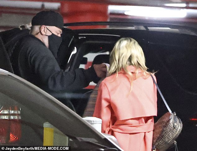 Kyle Sandilands and fiancée Tegan Kynaston leave the hospital with newborn son Otto