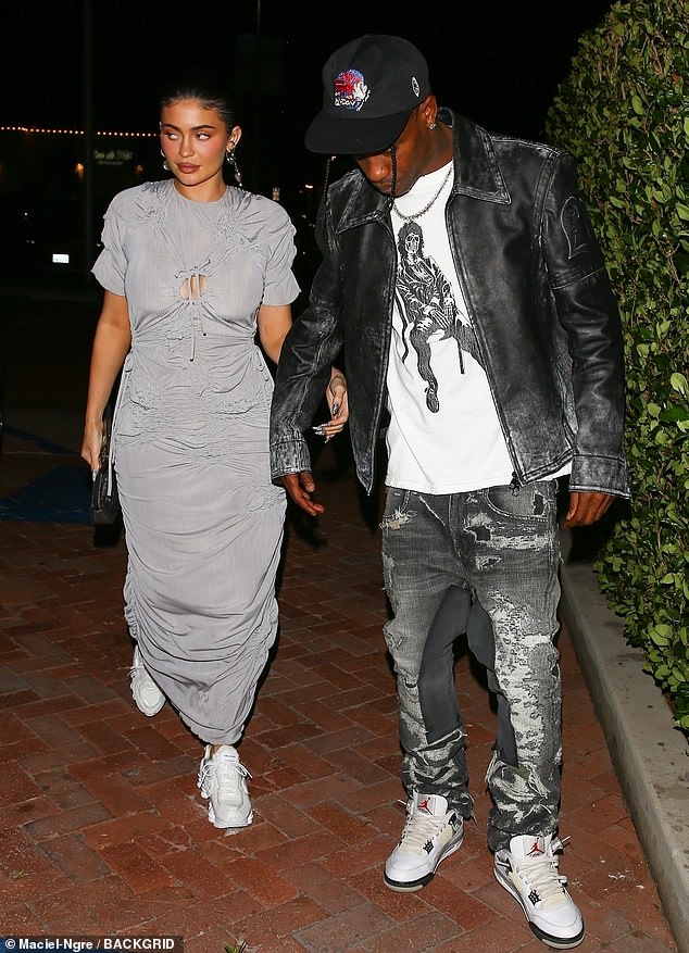 Kylie Jenner slips her curves into a grey ruched dress for dinner with beau Travis Scott in Malibu