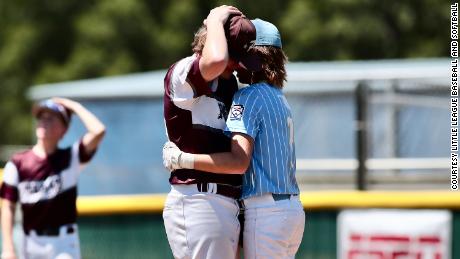 Oklahoma player Isaiah Jarvis, right, comforts East Texas pitcher Kaiden Shelton during the Little League Southwest Region championship on Tuesday after being hit by Kaiden&#39;s pitch.