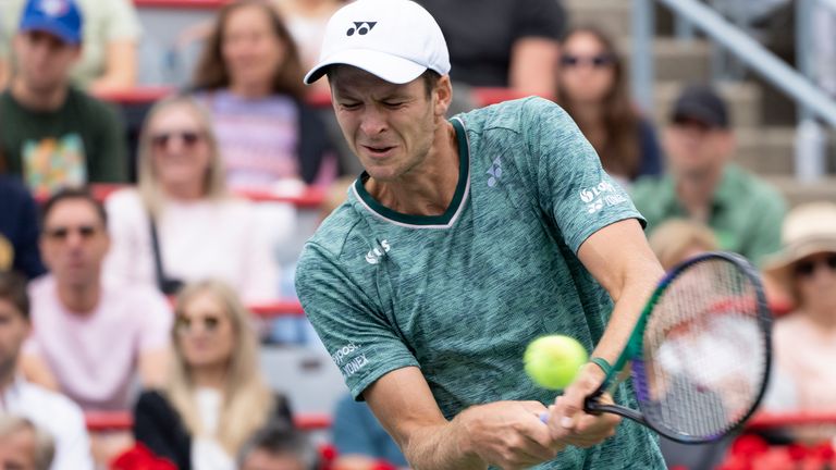 Hubert Hurkacz of Poland returns to Nick Kyrgios of Australia during the quarterfinals of the National Bank Open tennis tournament on Friday, Aug. 12, 2022, in Montreal. (Paul Chiasson/The Canadian Press via AP)