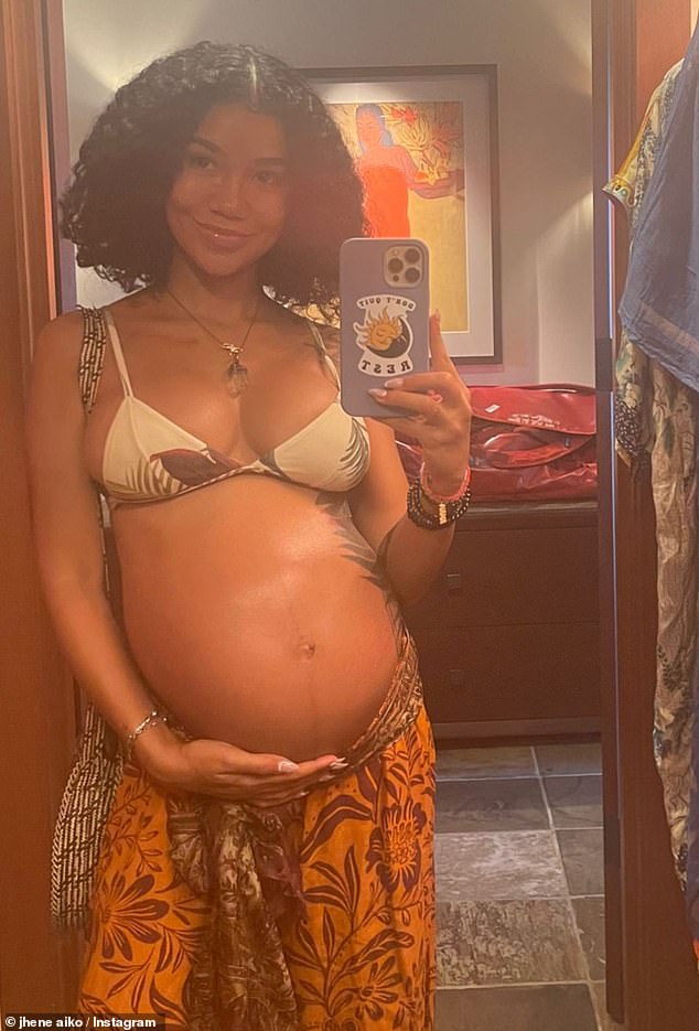 Pregnant Jhene Aiko showcases her blossoming baby bump in an array of bikini snaps