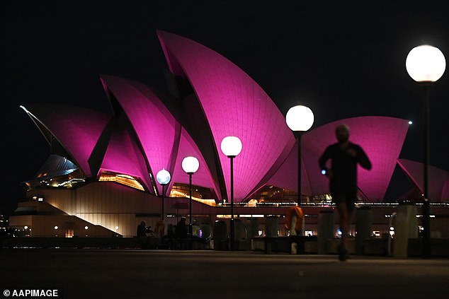 Sydney Opera House’s world famous sails are lit up in pink in tribute to Olivia Newton-John