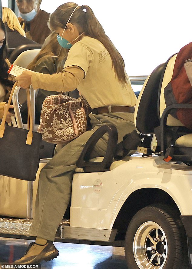 Terri Irwin chauffeured from Qantas lounge to a flight to Cairns with daughter Bindi and baby Grace