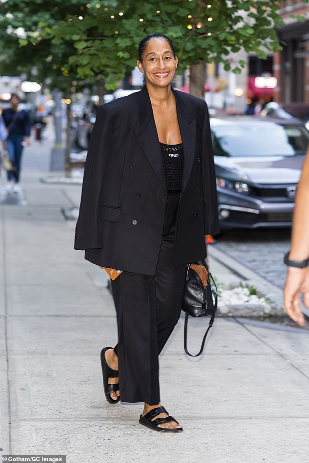 Tracee Ellis Ross flaunts cleavage in $1,050 Prada crop-top beneath baggy pantsuit in NYC