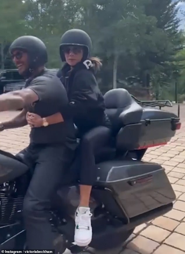 Victoria Beckham hops on the back of husband David’s motorbike for ride