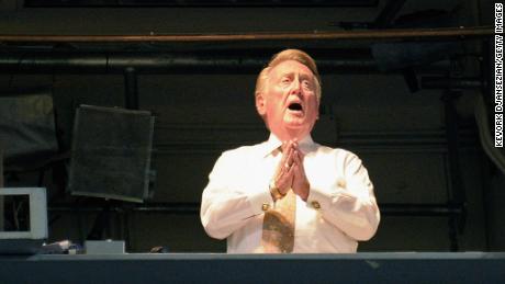 Vin Scully sings &quot;Take Me Out to the Ball Game&quot; during the seventh inning of a game between the Arizona Diamondbacks and the Los Angeles Dodgers on September 14, 2011.