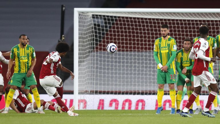 Arsenal&#39;s Willian scores their side&#39;s third goal of the game during the Premier League match at the Emirates Stadium, London. Picture date: Sunday May 9, 2021.