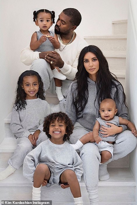 Family: Kanye is pictured with his estranged wife Kim Kardashian and their children North, nine, Chicago, four, Saint, six, and Psalm, three