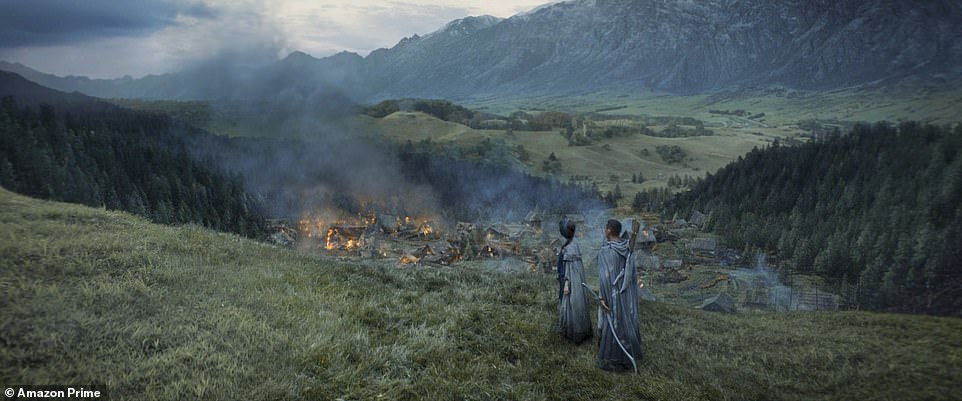 Fire: They scale the cliff's edge and find the village on fire as the episode transitions to the Sundering Seas where Galadriel and the rest are having their armor removed