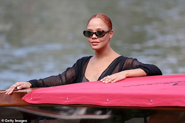 Stunning: She wore her chestnut tresses in a sleek ponytail with a middle-parting and wore a minimal amount of make-up to showcase her natural beauty