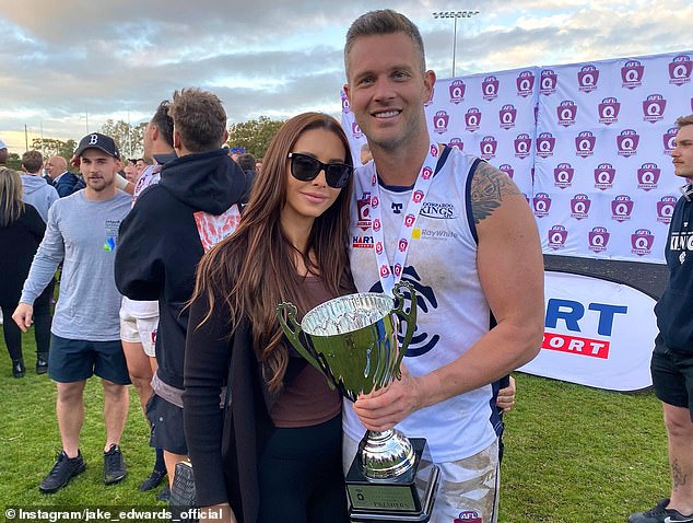 'Great To Be A King' he captioned the image, in which he held his trophy and stood alongside his girlfriend Clare Rankin (left)