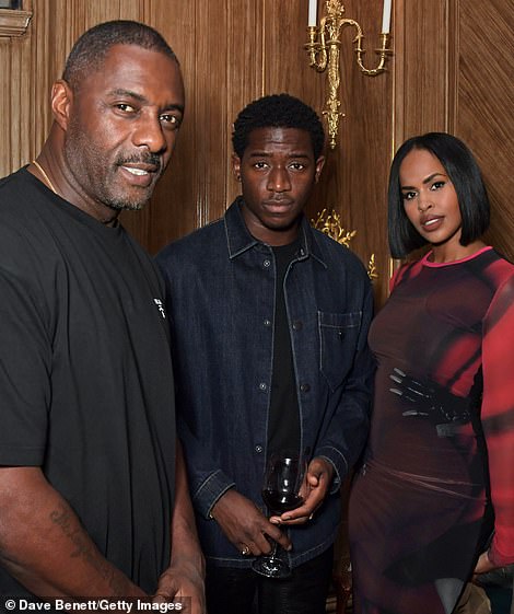 Stylish: Idris and Sabrina Elba put on a chic display, as actor Damson Idris stood between the couple