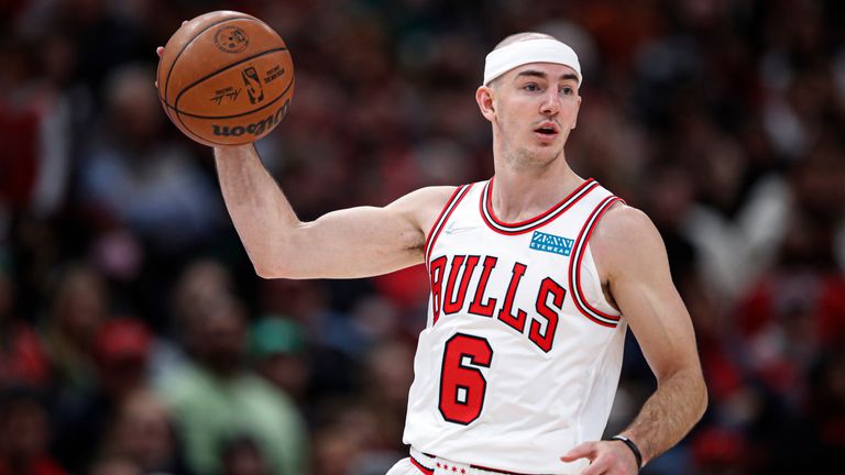 Chicago Bulls guard Alex Caruso brings the ball up court against the Cleveland Cavaliers 