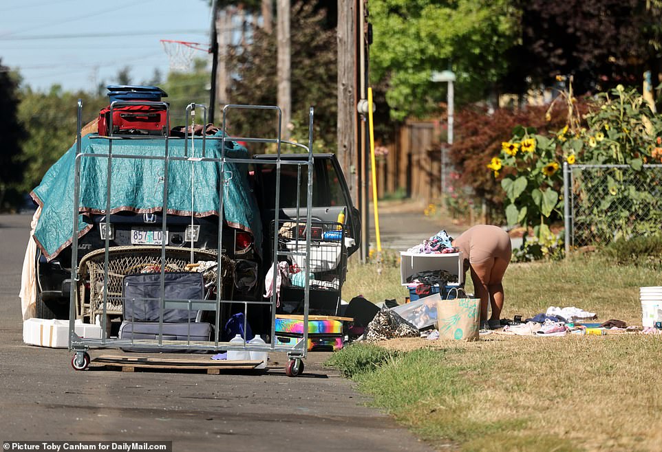 Several people are camped out in their cars, RVs and tents along the North Syracuse Street near the Peninsula Crossing Trail