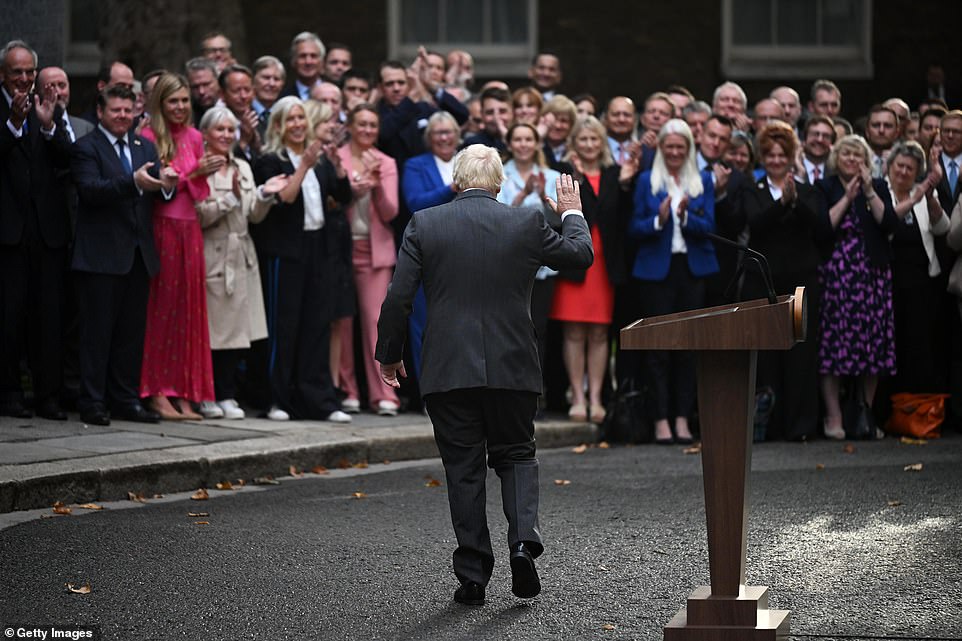 Mr Johnson put on a cheerful front as he waved to his supporters in the street today