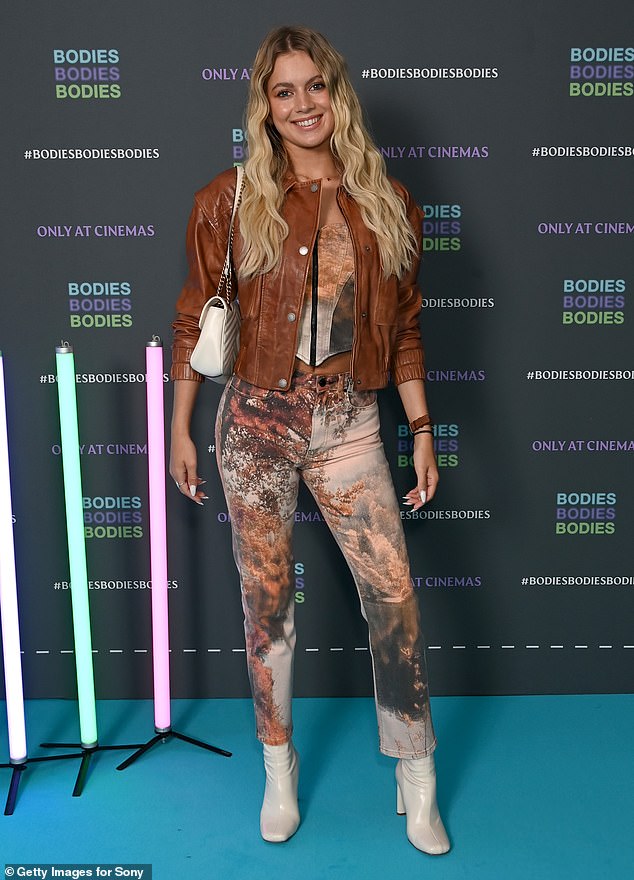 Coordinated: The Love Island star, 24, who finished in fourth place on this years reality series, cut a stylish figure in a brown and orange corset top and coordinated straight leg jeans