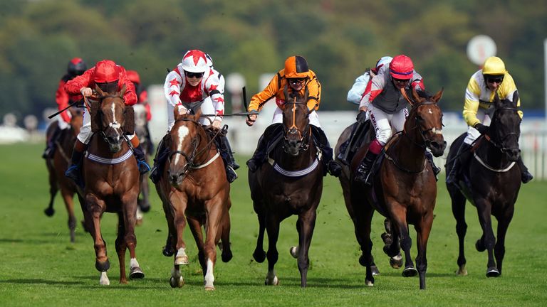 Sammy Jo Bell (red and white) wins her second Leger Legends race at Doncaster