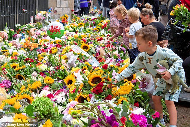 Thousands of flowers were laid on the Long Walk outside the gates of Windsor Castle today following the death of Queen Elizabeth II on Thursday