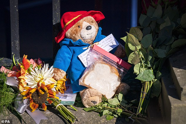 Children across the nation have paid their respects with the teddy bears and sandwiches in a nod to the delightful sketch filmed for the Queen's Platinum Jubilee in June. Pictured: A Paddington tribute left outside the Palace of Holyroodhouse in Edinburgh on September 10