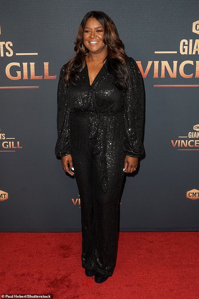 Lovely: Wendy Moten stood out while wearing a sparkling black sleeved dress during her time on the red carpet